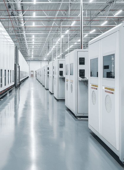 photo of inside factory facility showcasing the rows of machines